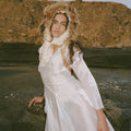 A versatile dress inspired by the mythical Xana, the Asturian forest fairy. Its open-back design with adjustable ties gracefully adapts to different body types, naturally enhancing femininity.