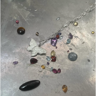 ONYX & RHODONITE -  exudes a balance of strength & protection, with the softness of compassion & love 
