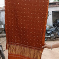Bandhani is an ancient Indian tie-dye technique, primarily from Gujarat and Rajasthan, that uses thread to bind small sections of fabric, creating patterns by resisting dye penetration