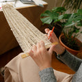 This garment is hand-woven by Irene Trapote, a multidisciplinary artist and researcher from Asturias.