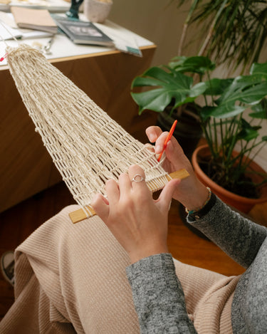 This garment is hand-woven by Irene Trapote, a multidisciplinary artist and researcher from Asturias.