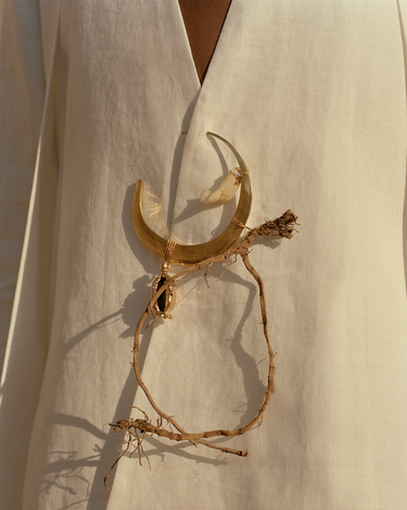 Please note this is the large crescent earring, but we included it here as reference for how it works as a brooch.